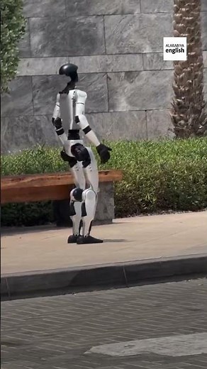 Humanoid robot runs across Dubai street
