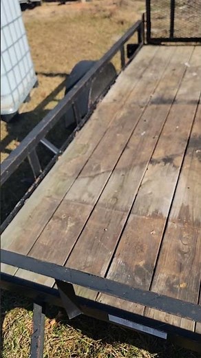 Preparing the utility trailer for softwash setup.