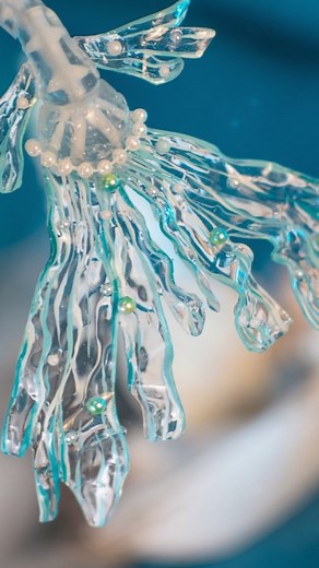 We made a translucent mermaid tail with a skeleton inside! We first did it for a Dark Layla doll, but we recently reused this idea and technique for making one of our Zodiac dolls, Capricorn. We modeled the pieces from scratch in Blender, 3D printed on our @elegoo resin printer in light blue translucent resin, glossed over all pieces, and filled the fishbone structure with white resin. The fins are made from transparent worbla covered in resin. It's making the worbla harder and more durable. We'