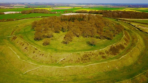Badbury Rings is an Iron Age hill fort in east Dorset, UK. It was in the territory of the Durotriges. In the Roman era a temple was located immediately west of the fort, and there was a Romano-British town known as Vindocladia a short distance to the south-west. | Abandoned Spaces