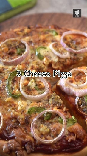 3 Cheese Pizza is one such flavorful recipe that would help you to win hearts. This snack recipe is a favourite among children and is loved by adults as well. It is a easy-to-make snack recipe that is topped with Cheddar, Mozzarella and cottage cheese. Do this Chessy treat at home Preheat the oven at 200°C for 10 minutes. Ingredients: For the base: ½ cup Warm water 1 tbsp Sugar 1 ½ tsp Dry active yeast 1 ½ cup All Purpose Flour/Maida Salt to taste 2 tbsp Oil 1 tsp Garlic powder Milk for greasing