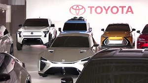 Toyota cuts output target as profits tumble