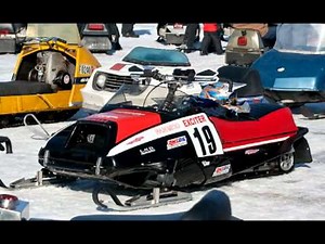 a fantastic vintage snowmobile with snopro