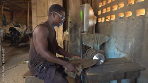 black african male Heavy metal worker at background of equipment and special tools