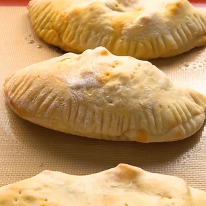 33K views · 304 reactions | This Homemade Calzone Recipe is so fun to make with your family. An easy dough and sauce combined with lots of gooey cheese and favorite pizza toppings make this a simple supper everyone will be happy to help prepare! https://www.favfamilyrecipes.com/calzones/ | Favorite Family Recipes | Facebook