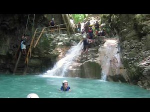 Jumping the final waterfall in the 27 Waterfalls of Rio Damajagua in the Dominican Republic