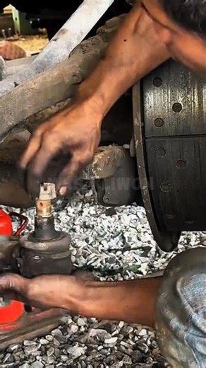 A mechanic demonstrates the technique for removing a stuck tie rod end on a truck#shorts #satisfying