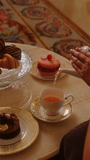 In the splendour of Blüthner Hall, savour the Grand Palaces Afternoon Tea, where crystal chandeliers cast a warm glow over buttery scones, palace-inspired desserts, and fragrant blends from Nina’s Marie Antoinette teas. #BlüthnerHall #LuxuryHotels #RafflesThePalmDubai ​​​ #RafflesHotels | Raffles The Palm Dubai