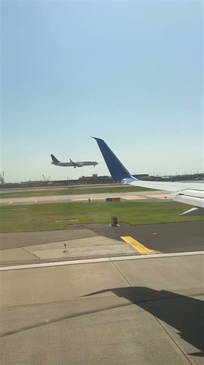 View of a Plane Landing at Newark International Airport in New Jersey from an Airplane Window