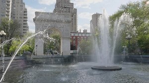 Handheld shot of Washington Square Park on a spring day
