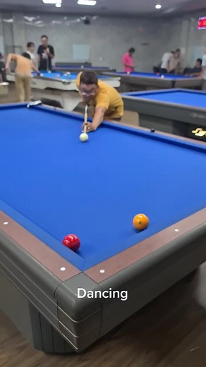 Playing Pool: Striking the Cue Ball on a Blue Felt Table