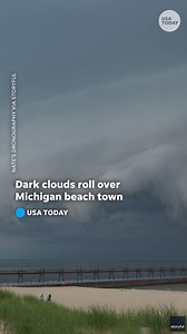 Timelapse: Massive shelf cloud rolls over Lake Michigan beach town