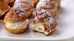 Golden, airy cream puffs made easy at home with crisp shells and fluffy cream filling.
