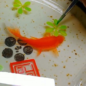 Watch as these goldfish become 3D as layers of resin are painted. | Fluid Art Studios