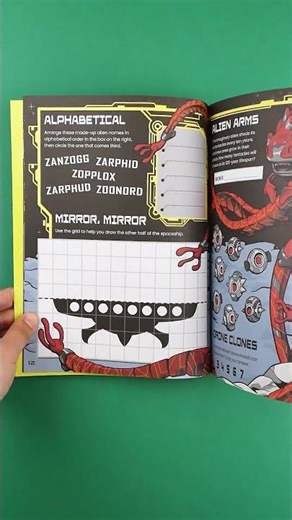 A big book full of fun alien-themed puzzles and fascinating facts! 👽
