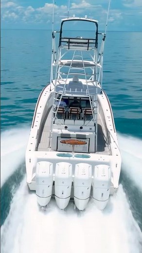 Sharp looking Front Runner 47 with quad Mercury 600s and a full tower running down in the FL Keys