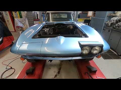 How to remove headlight doors/ buckets from C2 Corvette