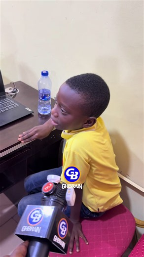 Hon. Samuel Nartey George engages a young boy interested in learning Artificial Intelligence (AI) during his visit to the Asawase Community Information Centre (CIC), as part of efforts to promote digital skills and encourage young people to embrace emerging technologies.