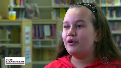 Students learning sign language to support a classmate
