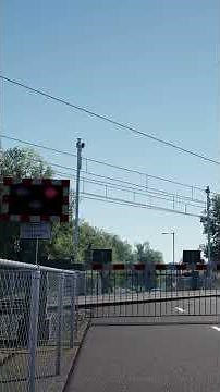 Train Passing United Kingdom Level Crossing
