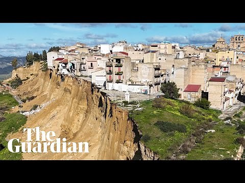 Houses and cars teeter on cliff edge after Sicilian landslide