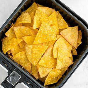 RECIPE: https://www.rachelcooks.com/air-fryer-tortilla-chips/ Imagine warm, restaurant-style tortilla chips made at home. Air fryer tortilla chips satisfy your cravings for a crisp salty snack in just a few minutes. | Rachel Cooks