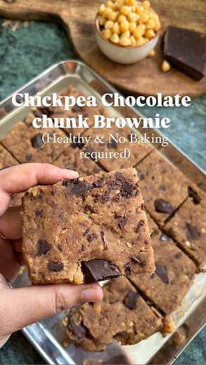 Food•Health•Lifestyle on Instagram: "No bake- CHICKPEA CHOCOLATE CHUNK BROWNIE BITES! 🍫✨ Loaded with protein and fibre these tasty treats are perfect for a healthy dessert/ snack. They do taste like protein bars too! So it’s like you have your protein bars at hand whenever you make them and store in the fridge!🤗 Ingredients: Boiled Chickpeas- 2 bowl Almonds - 1 bowl (You can add any nut of your choice) Dates- 15-16 (depending on how sweet you want this) Vanilla essence- 3-4 spoon Milk - Around