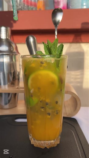 🍹 PASSION MOJITO MOCKTAIL – No Booze, All the Vibes 🌿✨ Behind the bar today: a refreshing, tropical twist on the classic mojito — but totally alcohol-free! I’m keeping it classy, minty, and full of passion (fruit, that is). Let’s get mixing 👇 🧊 Ingredients: Fresh mint leaves 🌿 1/2 lime, cut into wedges 🍋 1 passionfruit puree or juice 🥭 1 spoon of sugar 🍬 ice cubes❄️ Soda water or sparkling water 💦 Garnish: mint sprig lime wheel #mojitos #bar#mocktail#drink#classicmojito#bartender#cheers