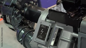 Close-up of axle with electric motor and transmission for a electric bus or truck.