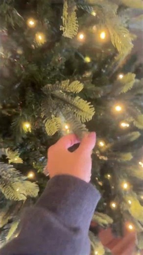 Transform your space into a winter wonderland with this Realistic Artificial Christmas Tree,