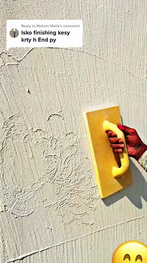 Applying Plaster with a Yellow Trowel