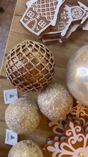 Christmas Tree Decorating School—Step 4: Ornaments! Now that your ribbons, sprays, and florals are perfectly layered, it’s time for the finishing touch: ornaments. This is where your tree truly comes alive. Mix shapes, sizes, and textures—shiny, matte, glass, and metal—so each branch feels full, balanced, and effortlessly curated. For our Neutral Gingerbread tree, I layered classic round ornaments with a few fun gingerbread accent pieces, tucking some deep-hued pieces behind florals and letting 