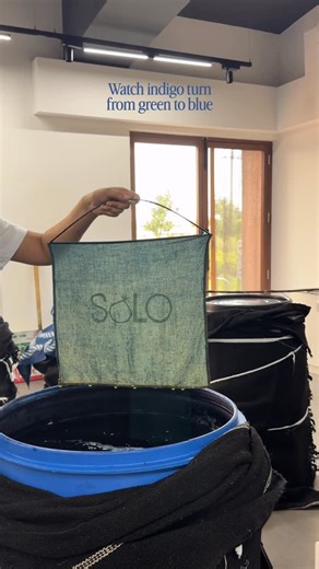 SOLO|Natural dyes on Instagram: "Indigo magic 🪄✨ Freshly reduced indigo always starts green. The moment it meets oxygen, it shifts to blue. This oxidation step is what fixes the pigment onto the fibre. Green → Teal → Deep Indigo in just a few seconds. The chemistry is the magic. #naturaldyeing #naturaldye #naturaldyes #indigo #indigovat"