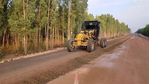 CAT Road Grader Operating in Rural Surroundings