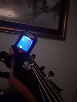 tuning bass guitar with electronic tuner