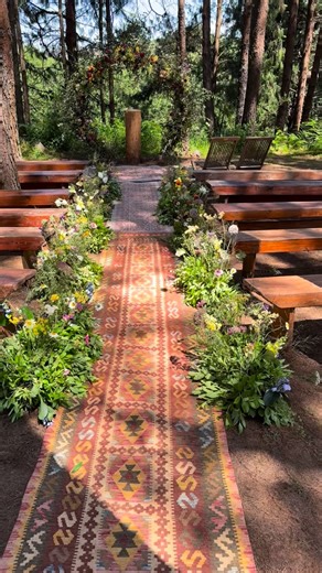 Mina’s Farm Venue on Instagram: "A meadow aisle tucked into the forest 🌿 Beautiful handpicked flowers, greenery and grasses lining the path, leading to a beautiful arch beneath the pine trees. Natural, romantic in the most effortless way, and designed to feel as though it belongs exactly where it is. This ceremony space will always be one of our favourites — simple, elegant, and timeless. Happy happy 2026 ✨ We’re so excited for the year ahead🤩 and can’t wait to create more beautiful moments wi