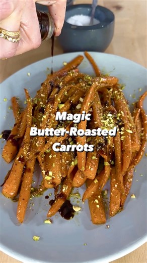 We call these “magic” carrots because they’re so much better than the simple olive oil-roasted variety; carrots that appear jewel-encrusted and are injected with life, texture, and vibrant flavor. We get super-sweetness and meltingly tender texture by slow-roasting the carrots, and a drizzle of butter caramelizes and adds fragrant nuttiness. Orange zest and juice wake up the flavors, balanced with earthy za’atar and tangy pomegranate molasses. Crunchy pistachios add a finishing touch to create a