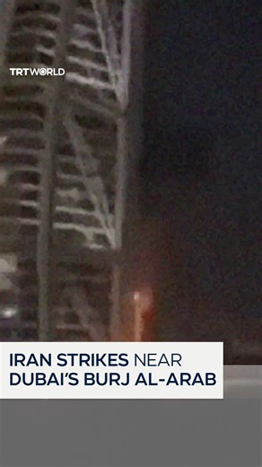Smoke and flames rise in the area surrounding Dubai’s Burj Al-Arab hotel after an Iranian strike near the landmark in the United Arab Emirates. | TRT World