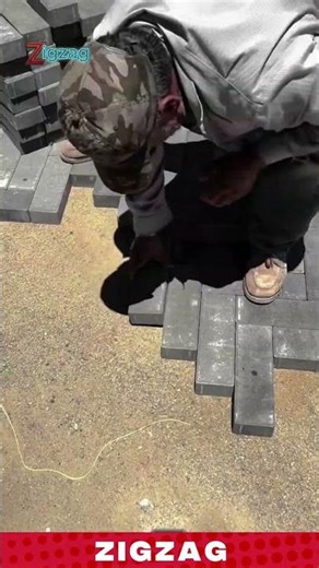 Worker Installing Interlocking Bricks to Form a Strong and Neat Pavement Surface