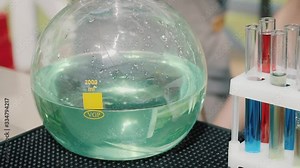 in nature on a light background of a barman show pouring a cocktail time lapse, test tubes with different alcoholic cocktails professional bartender