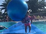 Hilarious moment a little girl gets hit by an inflatable ball