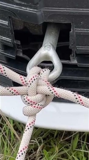 someone is tying a rope neatly and attractively