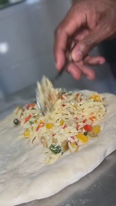 Deep-fried pizza: once you’ve tasted that crispy golden crust with melted cheese and toppings inside, there’s no going back! The perfect blend of crunch and gooey goodness creates an irresistible craving with every bite. Warning: this might be the start of a serious love affair with pizza like you’ve never had it before! #DeepFriedPizza #CulinaryExperience #Gastronomy #TobagoEats #FoodAddiction #Arahouse #TasteTobago #FoodieFinds #IslandFlavors #ElevatedEats” | Kinia Johnson