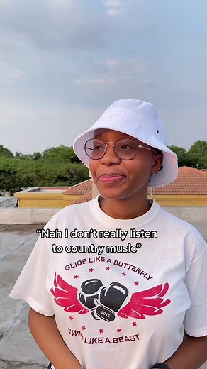 Energetic Rooftop Dance in Stylish Bucket Hat