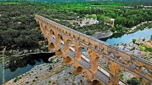 Aerial view of the aqueduct bridge with arched tiers in France. Drone view of Pont du Gard the highest Roman aqueduct bridge in the world.