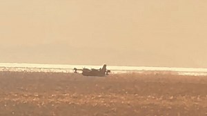 Firefighting Planes Scoop Water as Palisades Fire Rages in Los Angeles