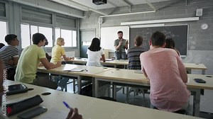 High School Teacher explaining technology science to teenager students learning electronics course preparation to University