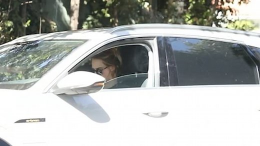 Cara Delevingne smokes in her car after sex shop visit