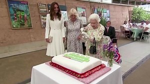 Queen cuts cake with sword at G7 event