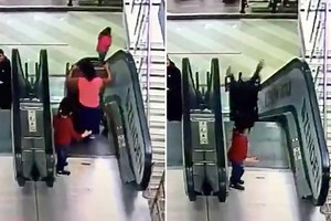 Kids left with head injuries after pram flips down escalator at shops